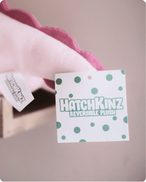 A photo of an eChapps Hathkinz toy, with the Hatchkinz label showing