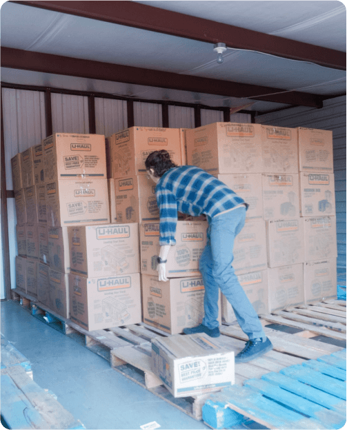 the eChapps team moves boxes from a storage unit